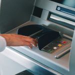 Woman,Using,Atm,Holding,Wallet,An,Pressing,The,Pin,Security